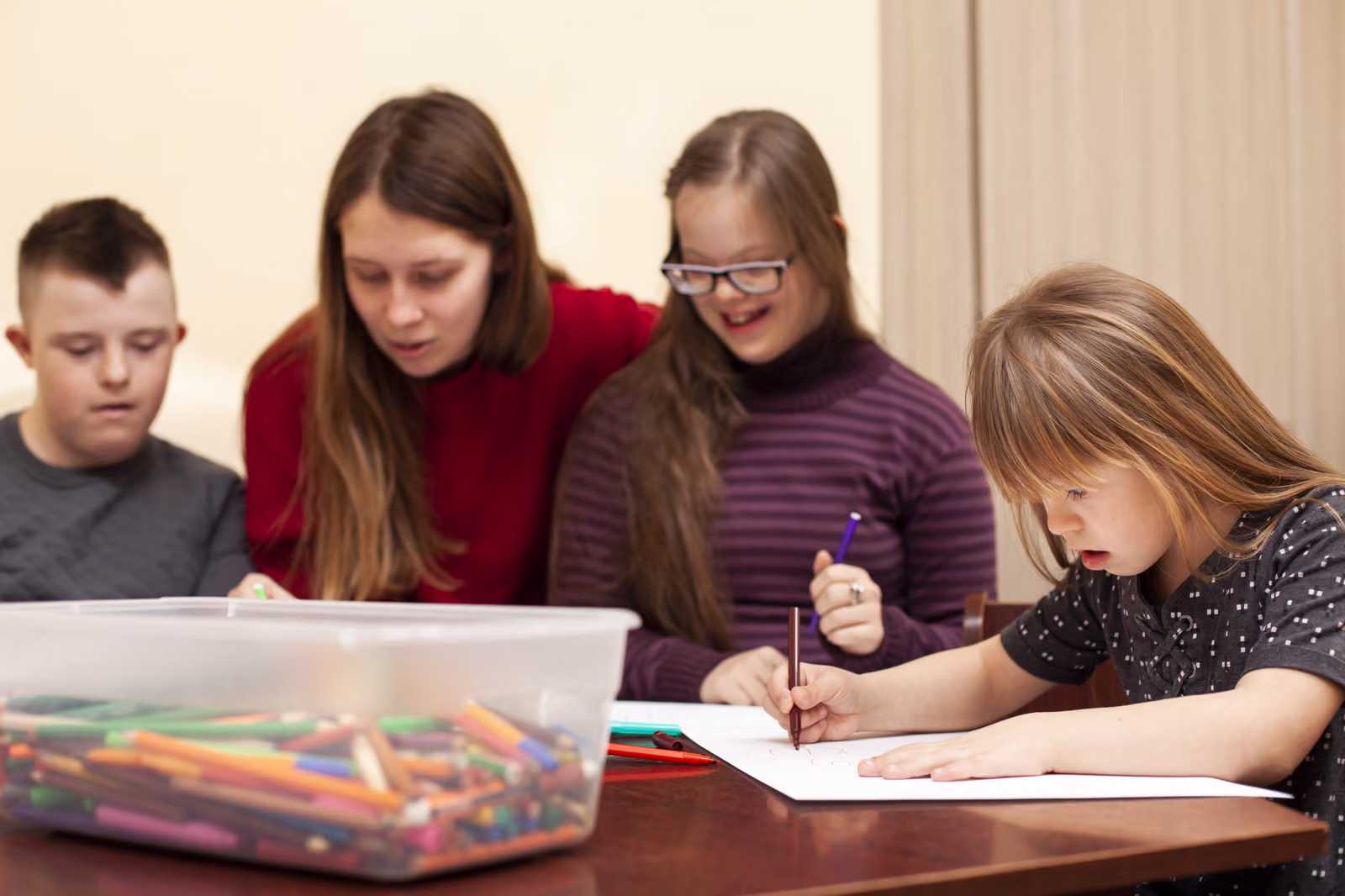 A group of young people drawing together